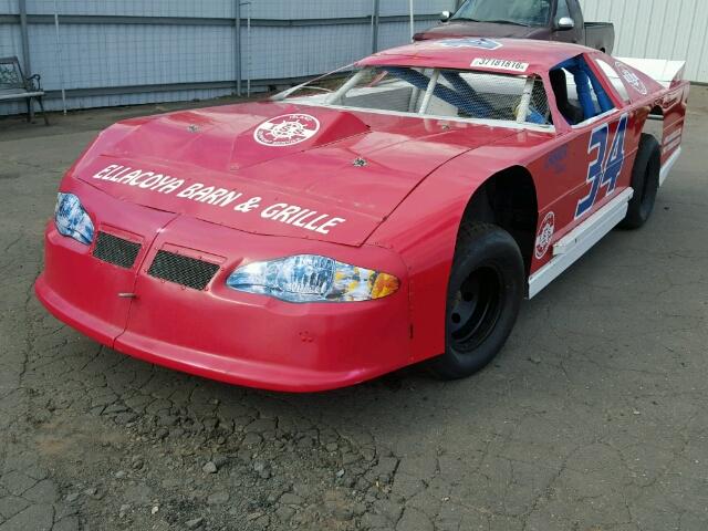 front left view 2009 Red Chevy Monte Carlo donated to Kars For Kids