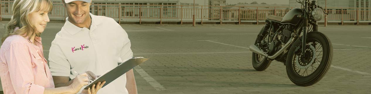 Motorcycle donation form being signed