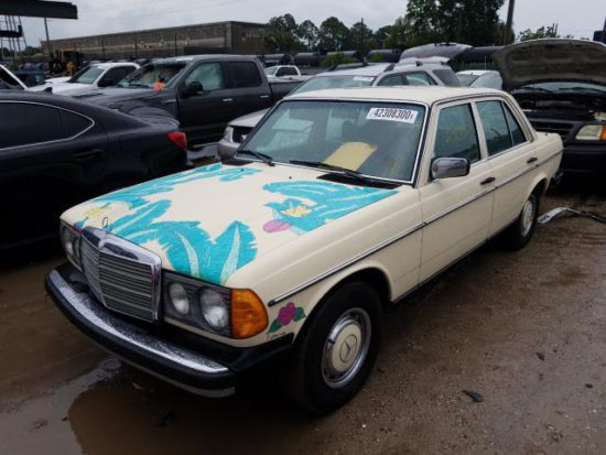 1977 Yellow Mercedes-Benz 240D with Teal Hood Design front left view