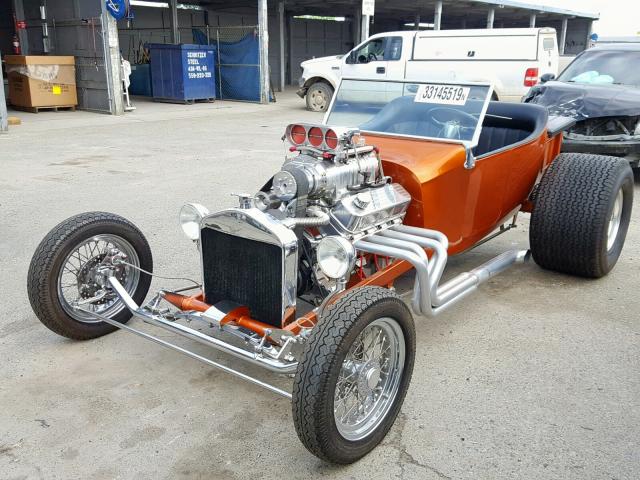 2000 Orange Ford Custom front left view