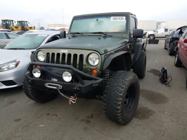 2005 Green Jeep Wrangler SE 2.4L front left view