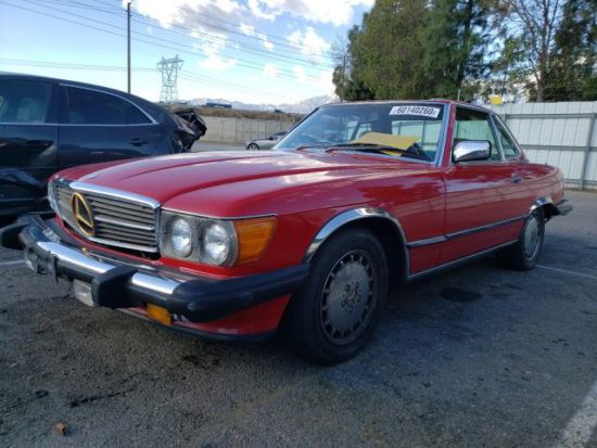 1986 Red Mercedes-Benz 560 SL (R107) - front left view